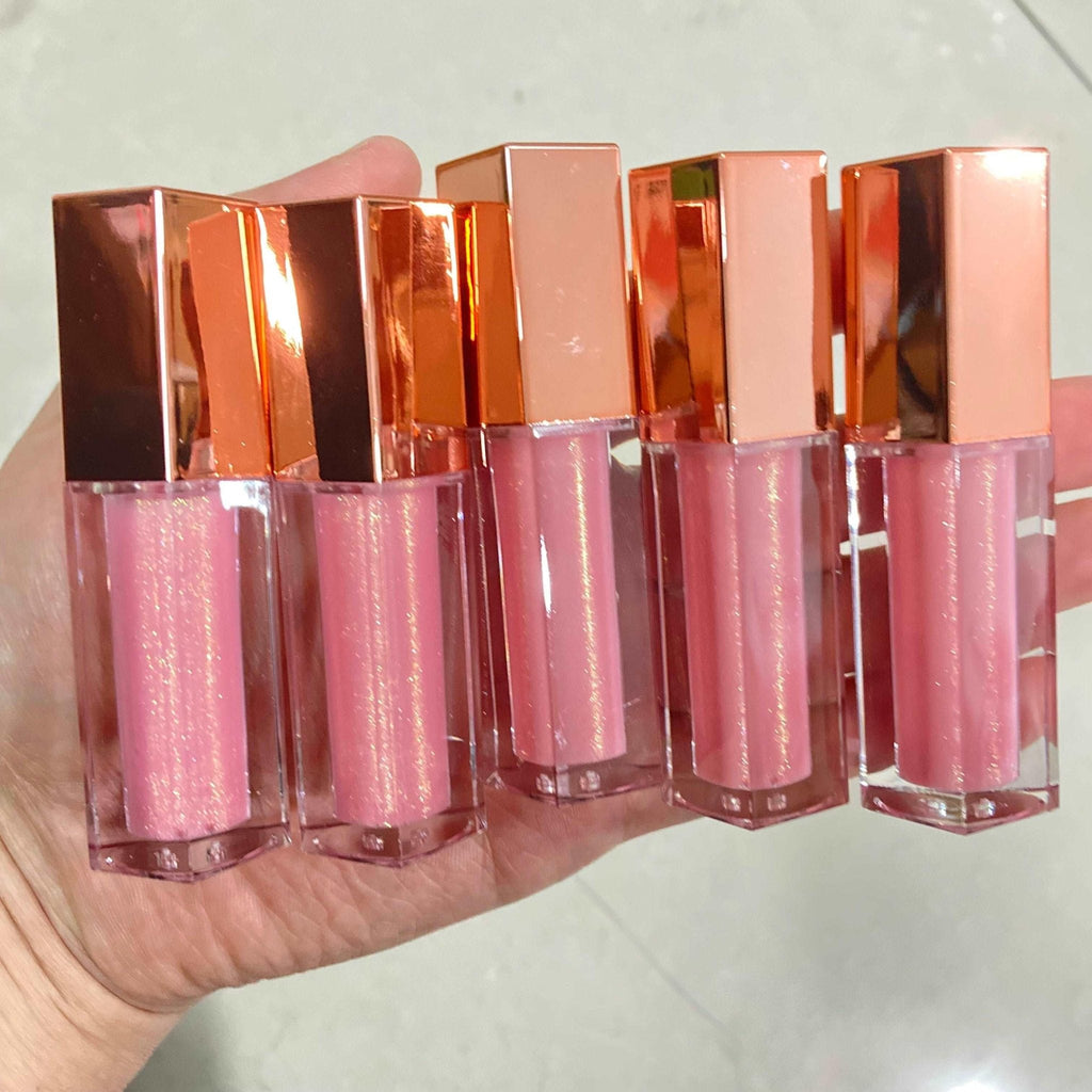 Eco-friendly vegan lip gloss in a sleek clear tube featuring vibrant high-shine moisturizing color