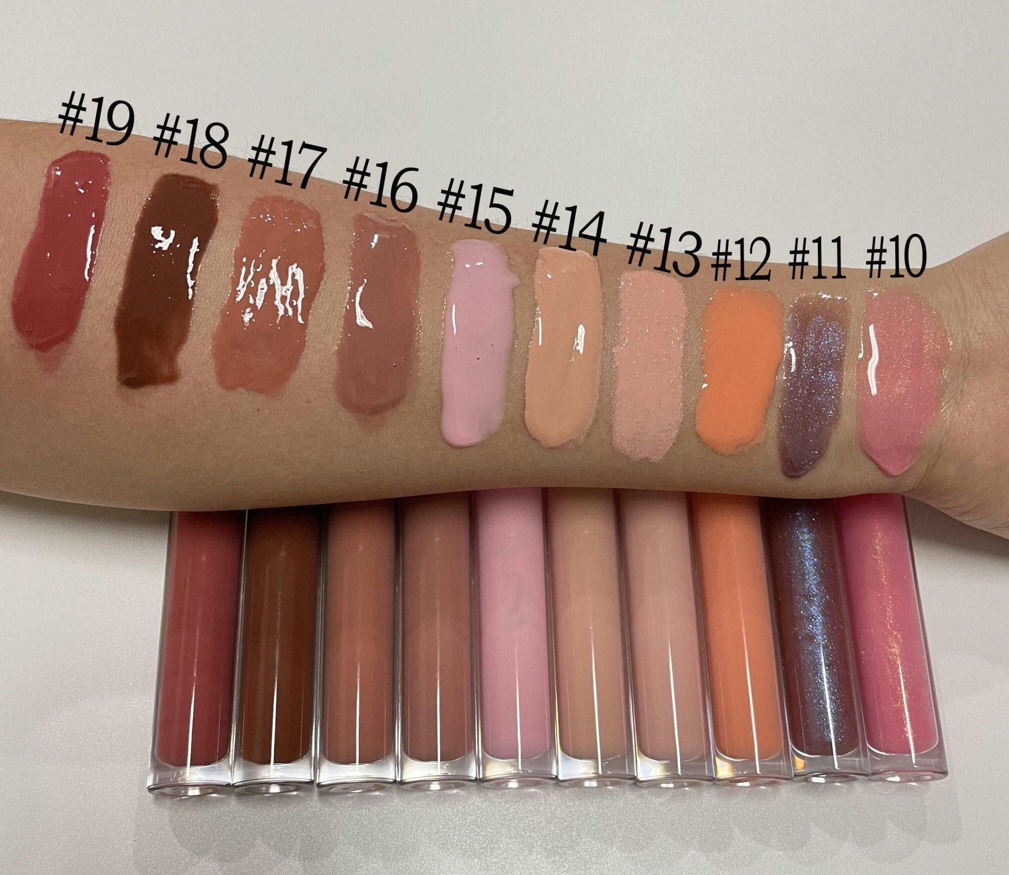 Eco-friendly vegan lip gloss in a sleek clear tube featuring vibrant high-shine moisturizing color — view 5