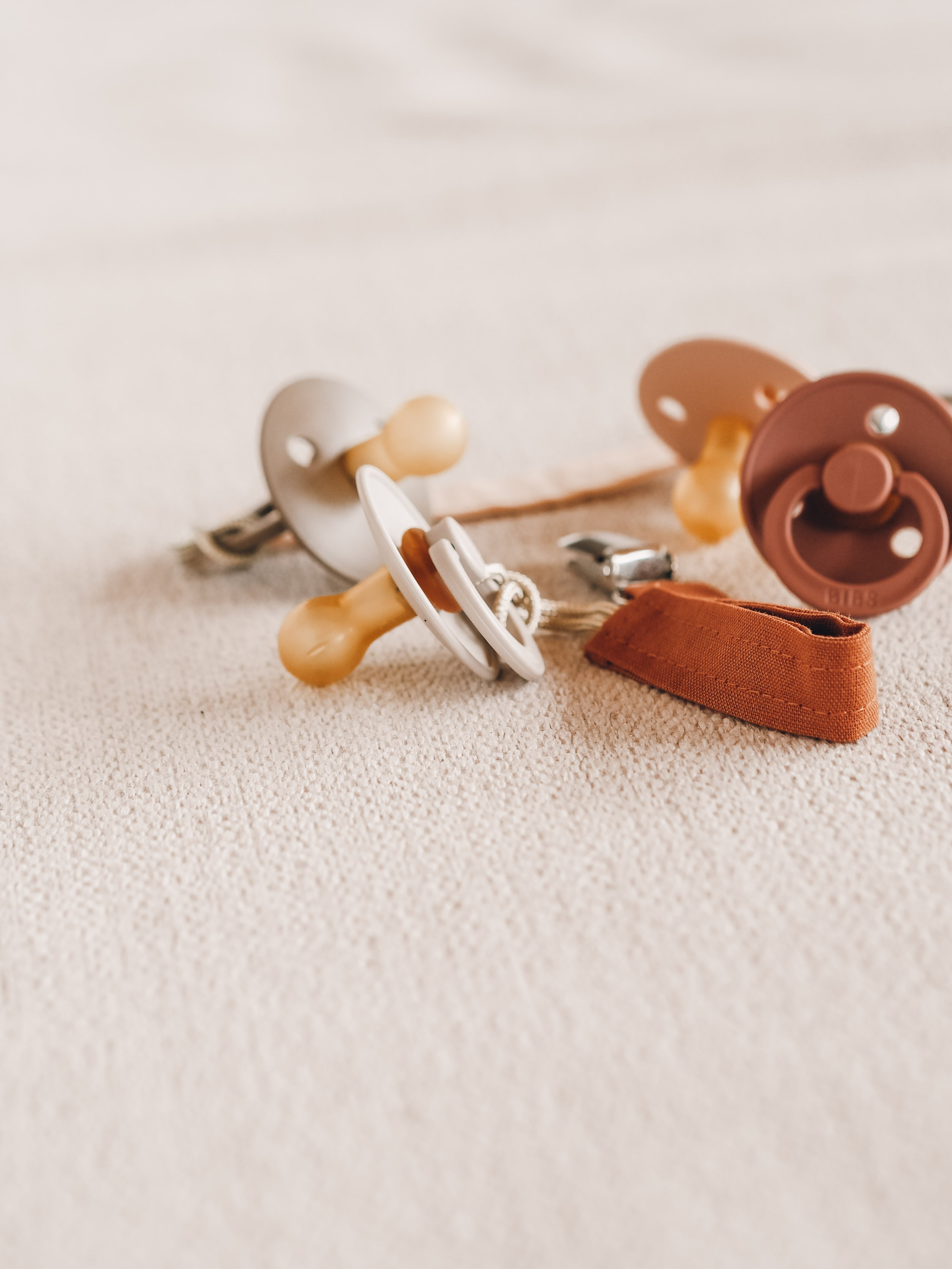 Soft silicone baby pacifier with fabric holder clip in natural earth tones for infants. — view 2