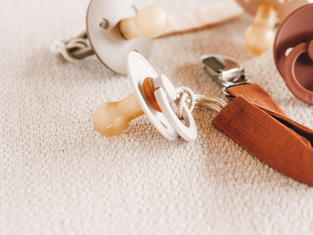 Soft silicone baby pacifier with fabric holder clip in natural earth tones for infants. — view 3