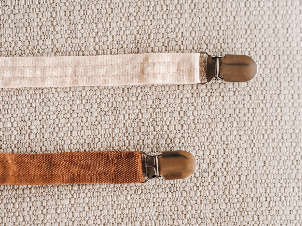 Soft silicone baby pacifier with fabric holder clip in natural earth tones for infants. — view 4