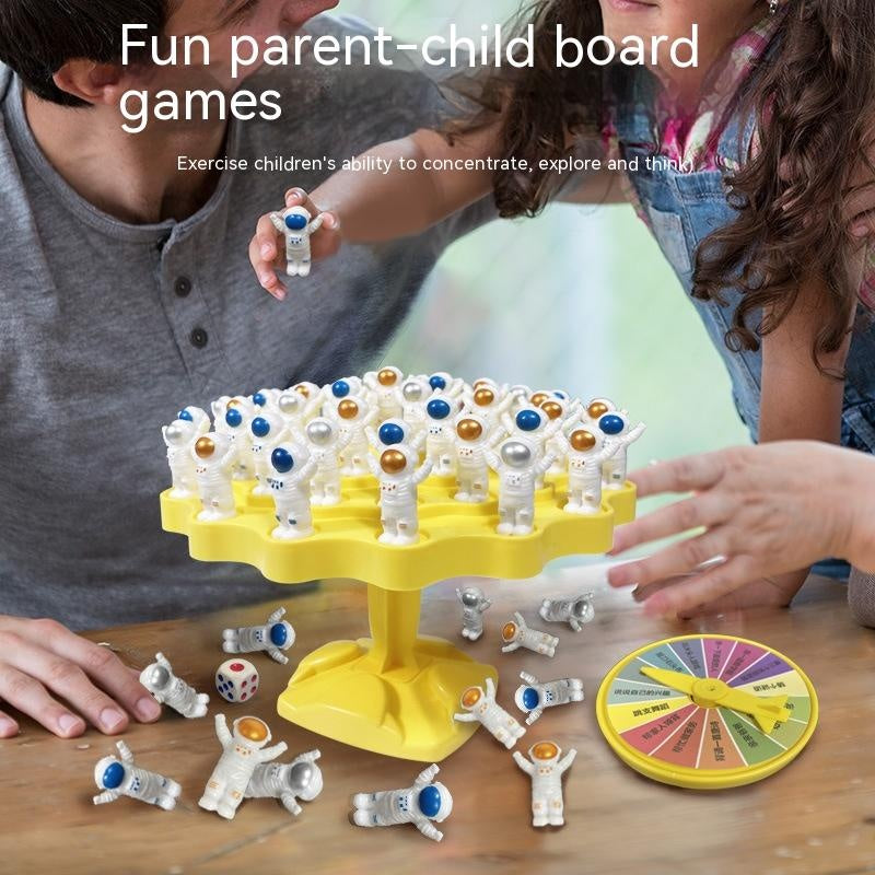 Educational space station board game with blue plastic platform, astronaut figures, and playing dice