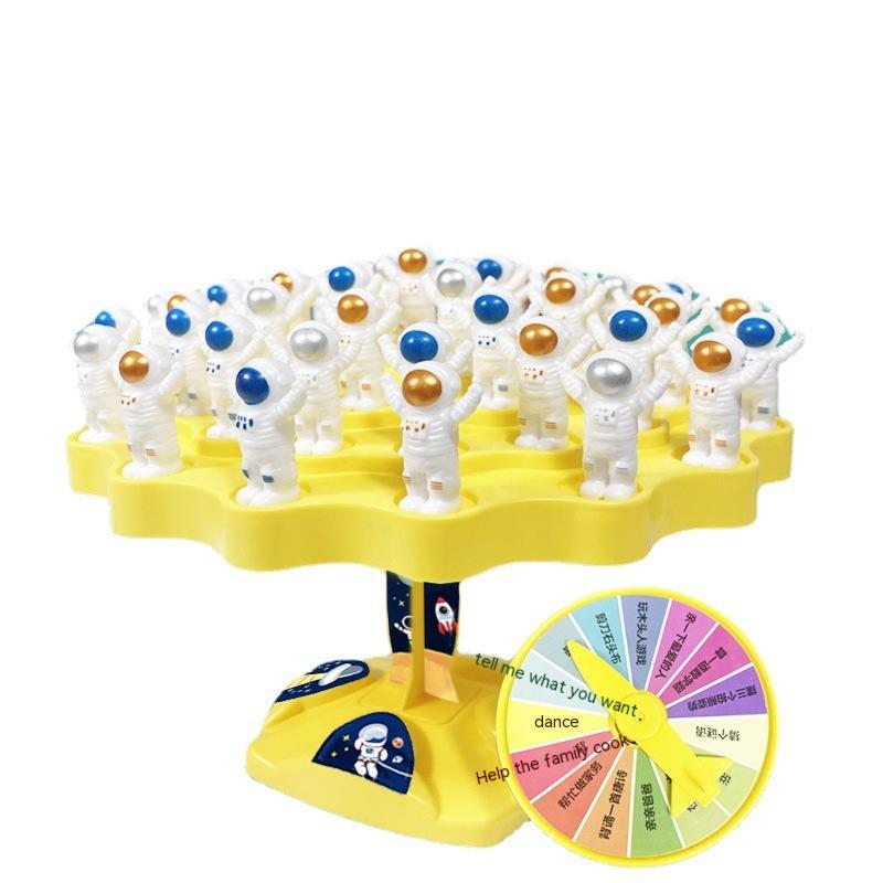 Educational space station board game with blue plastic platform, astronaut figures, and playing dice — view 2