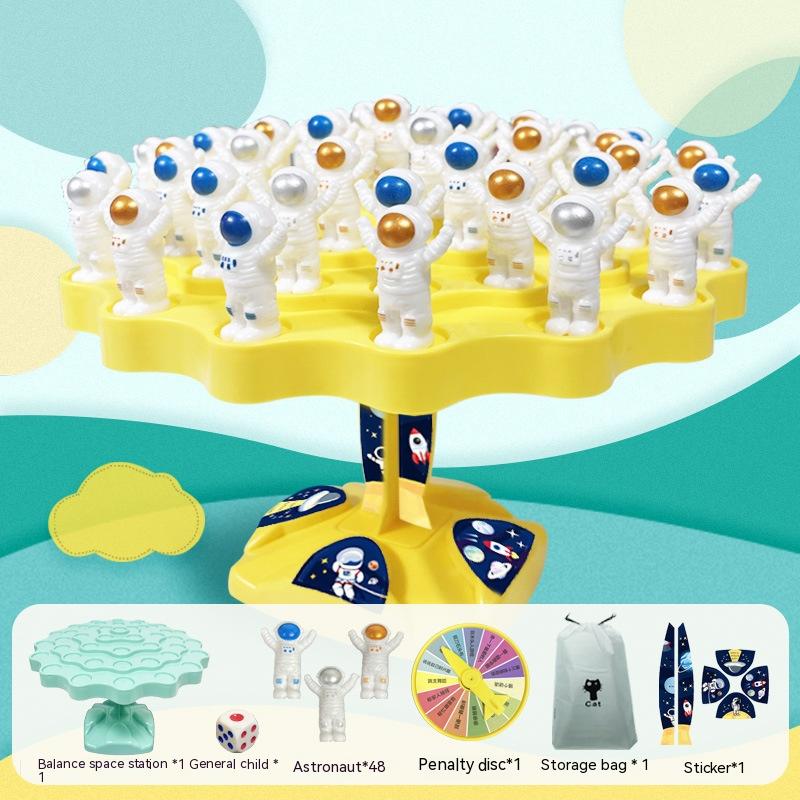 Educational space station board game with blue plastic platform, astronaut figures, and playing dice — view 3