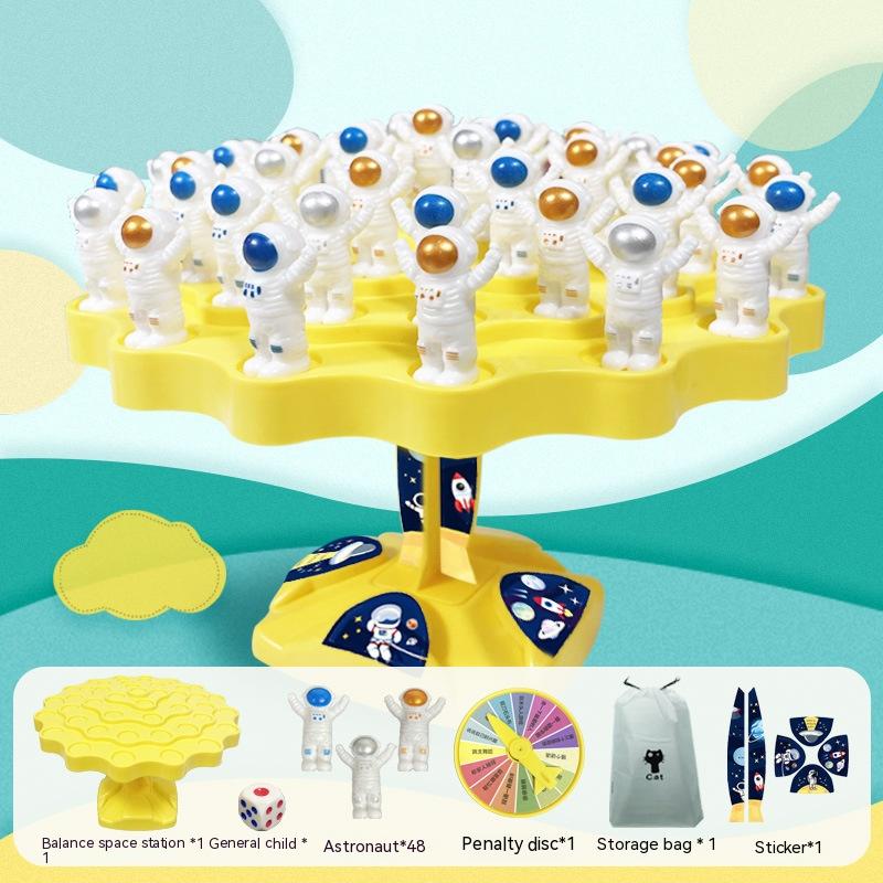 Educational space station board game with blue plastic platform, astronaut figures, and playing dice — view 4