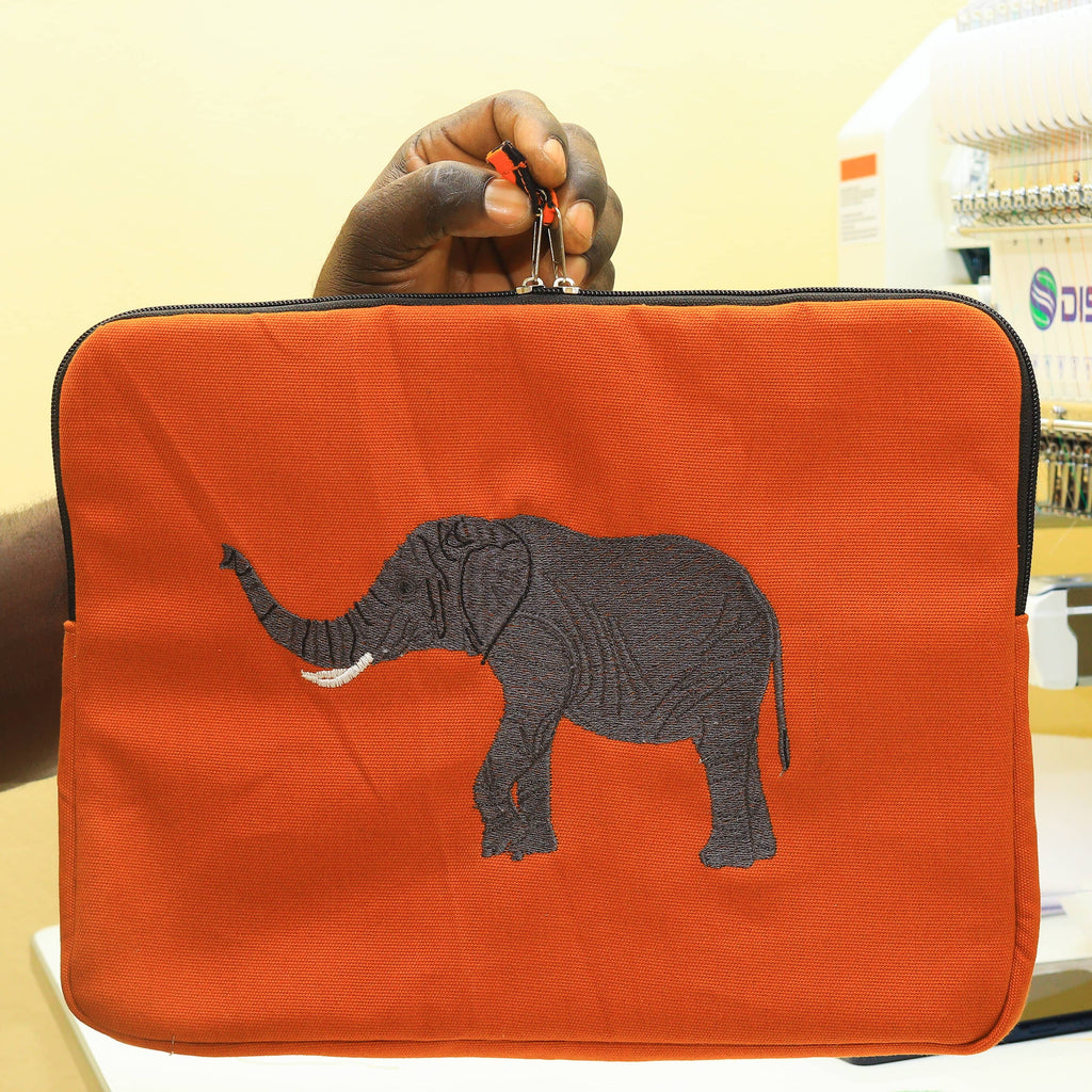 Elephant laptop sleeve in warm earthy cotton canvas with beautifully stitched savanna wildlife embroidery details. — view 2