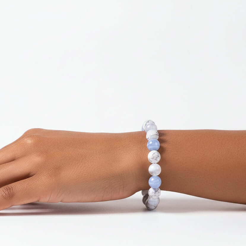 Handcrafted empath protection beaded bracelet featuring sky blue agate, white howlite, and selenite natural stones. — view 2