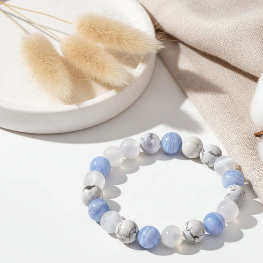 Handcrafted empath protection beaded bracelet featuring sky blue agate, white howlite, and selenite natural stones. — view 5