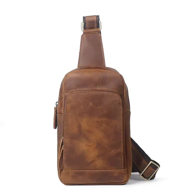 Erling leather sling bag in premium full-grain brown leather with an adjustable crossbody strap.