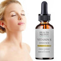 Dropper bottle of natural vitamin E essential face essence for hydrating and brightening radiant skin.