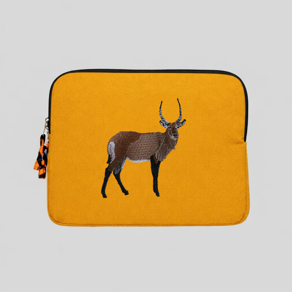 Handmade Kenyan cotton canvas laptop sleeve featuring embroidered African wildlife design in warm earthy tones