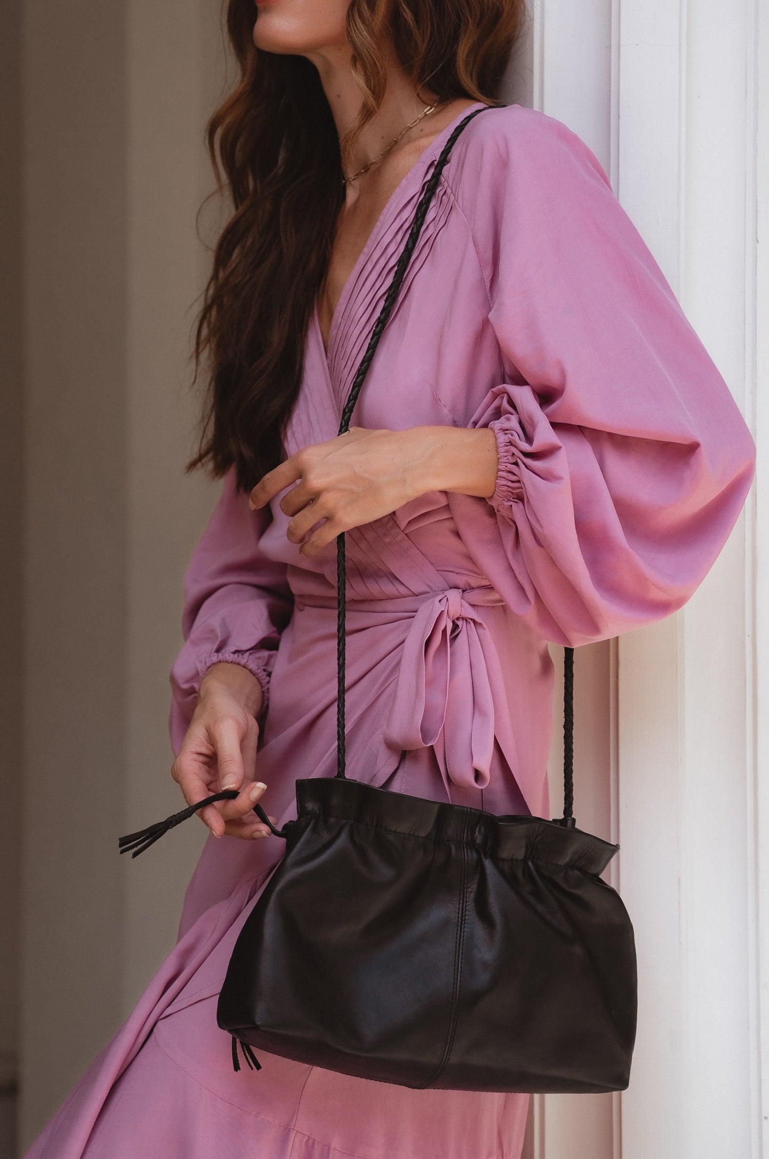 Etoile crossbody leather clutch bag in black genuine leather with braided strap and drawstring closure. — view 2