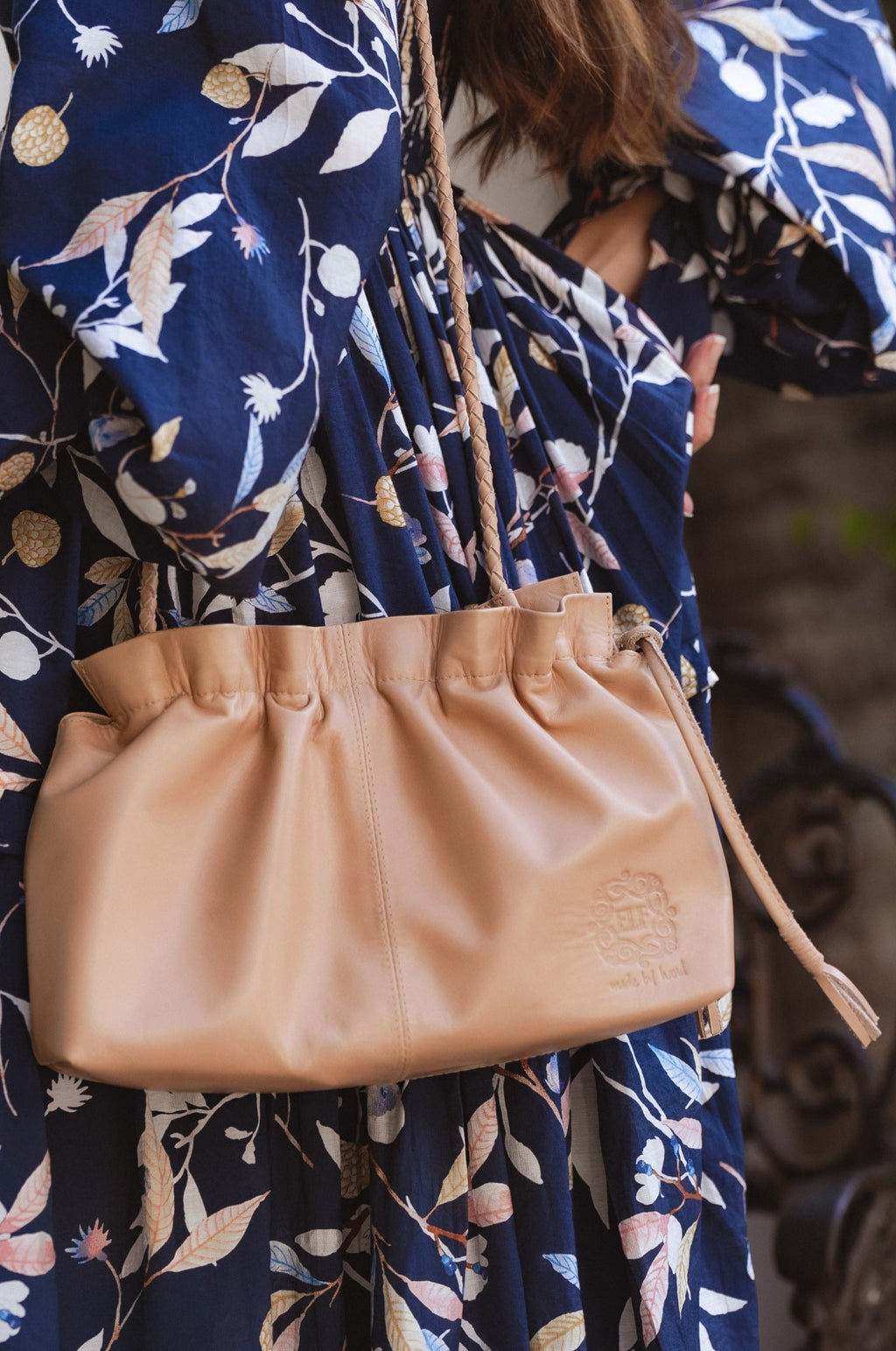Beige genuine leather Etoile crossbody clutch bag with braided strap and drawstring closure — view 2