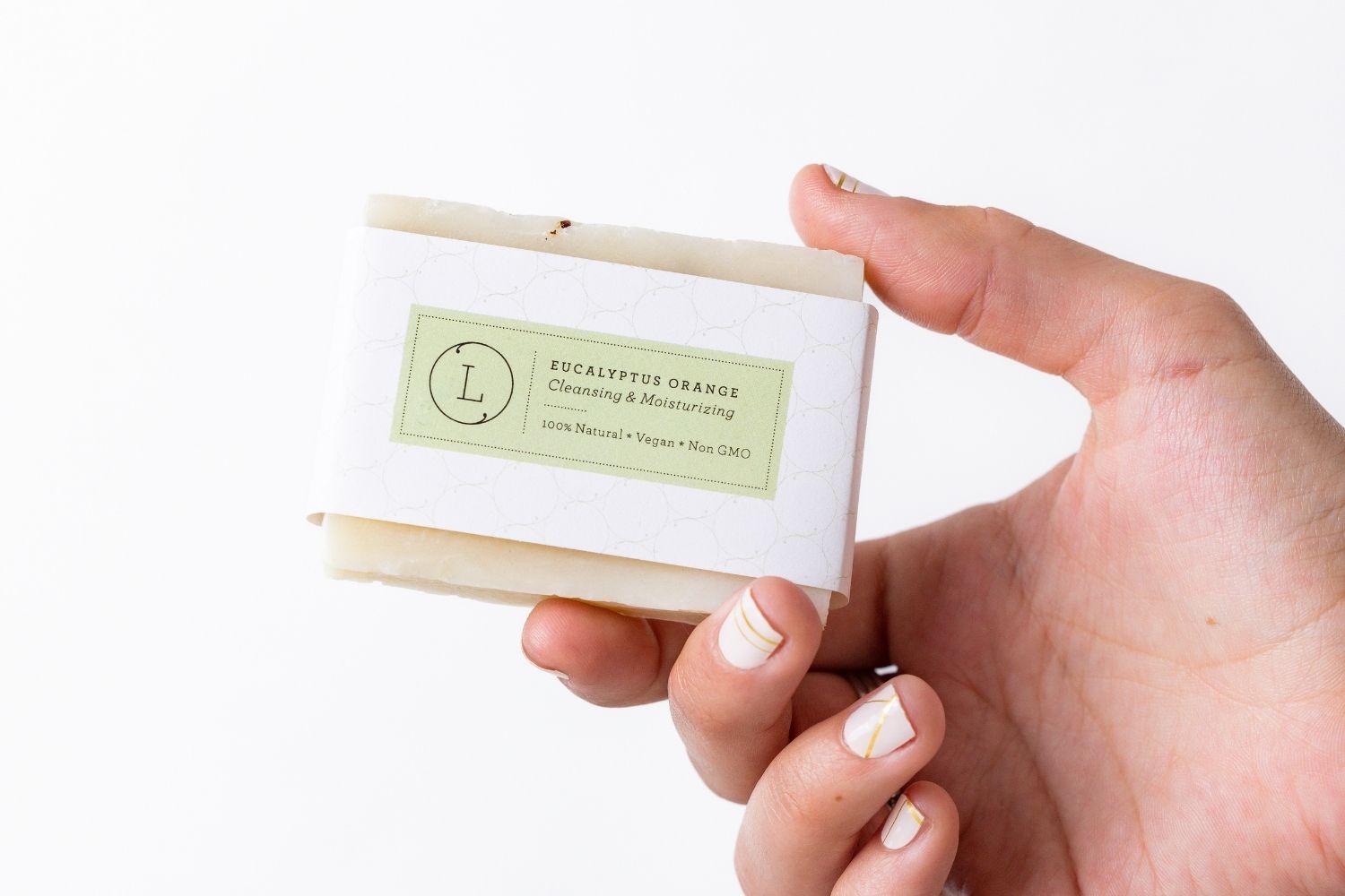 Two handmade natural eucalyptus cold process soap bars packed in a reusable cotton bag
