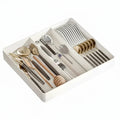 Expandable plastic kitchen drawer organizer tray with adjustable compartments for silverware and utensils