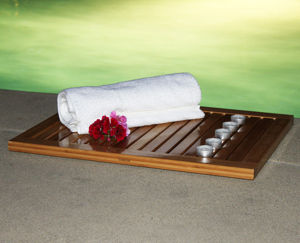 Natural bamboo shower mat featuring a slatted rectangular design with elevated anti-slip rubber feet underneath. — view 7