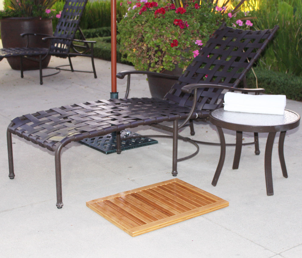 Natural bamboo shower mat featuring a slatted rectangular design with elevated anti-slip rubber feet underneath. — view 8