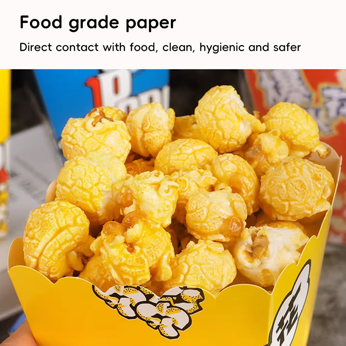 Vibrant yellow party popcorn boxes with black and white cartoon graphics for mess-free snacking — view 4