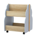 Grey and pine tree-shaped wooden kids bookshelf on wheels with double-sided storage tiers.