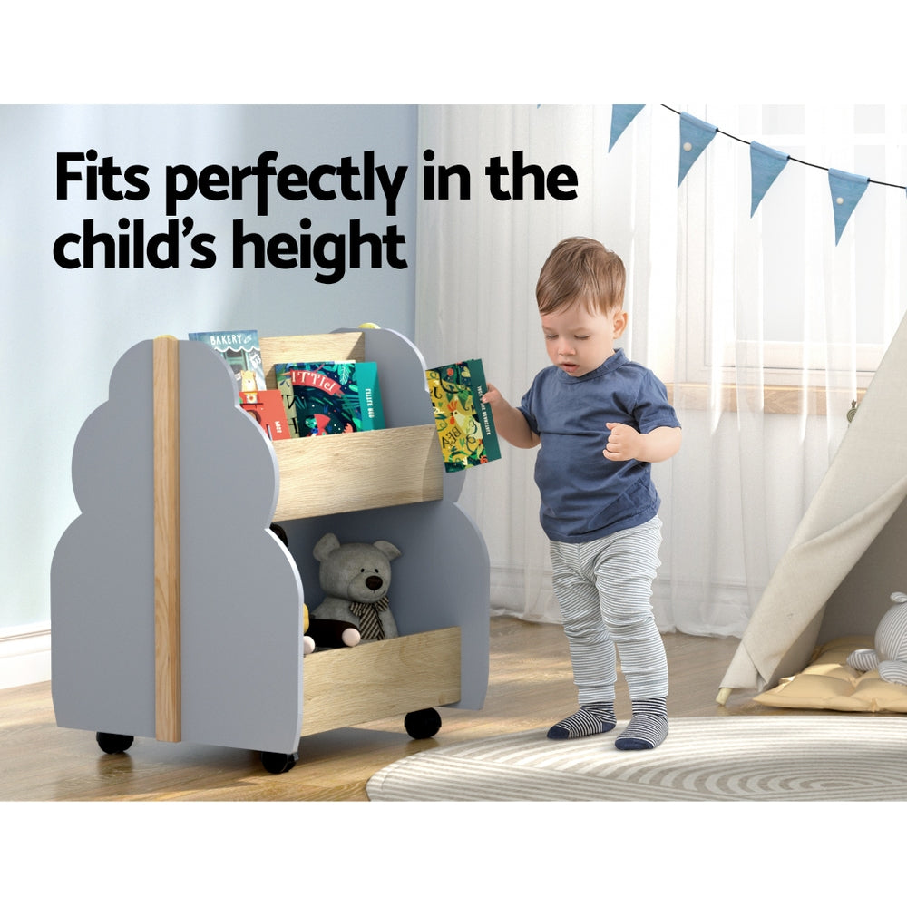 Grey and pine tree-shaped wooden kids bookshelf on wheels with double-sided storage tiers. — view 4