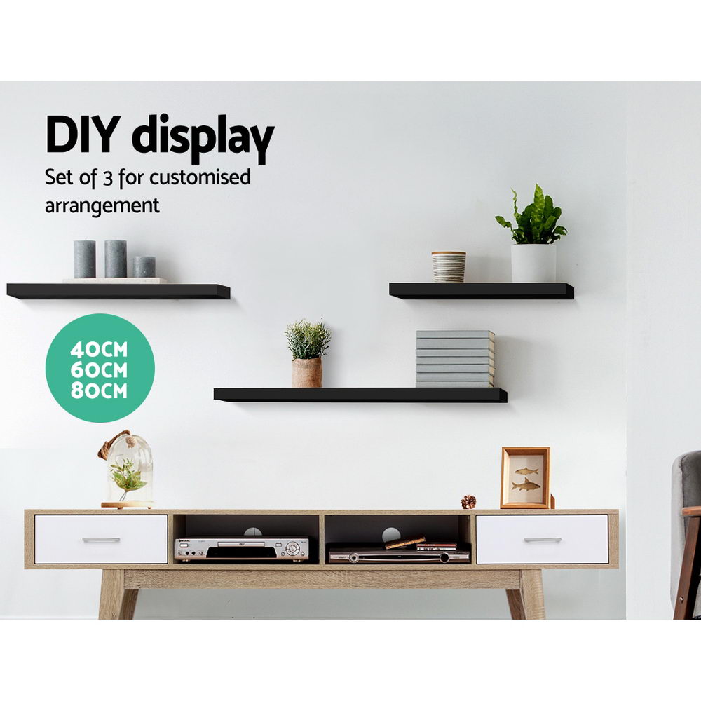 Three modern minimalist black floating wall shelves arranged on a wall for stylish home decor — view 3