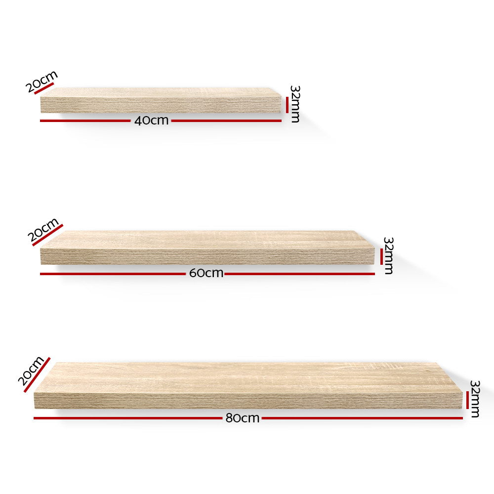 Oak floating wall shelves set of three mounted in a modern living room display — view 2