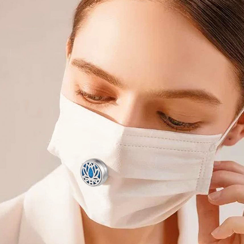 Wearable essential oil diffuser clip attached to a face mask for comfortable aromatherapy breathing — view 3