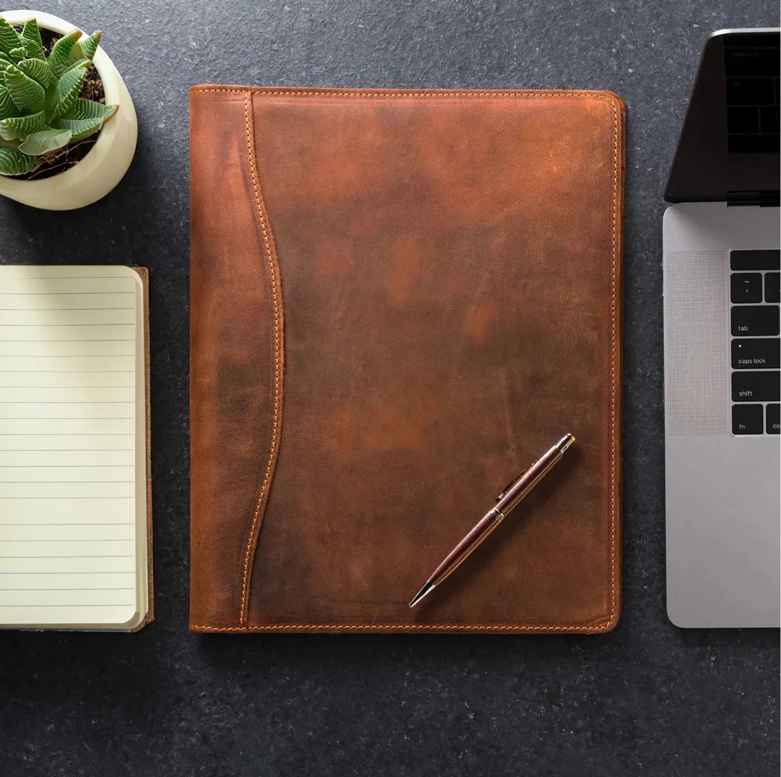 Handmade leather padfolio in vintage brown, open to show A4 document pockets and pen loop. — view 2