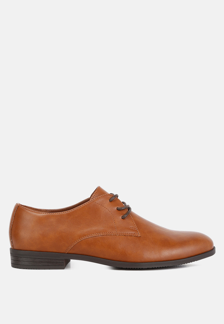 Black minimalist faux leather men's derby shoes with lace-up fastening and low block heel.