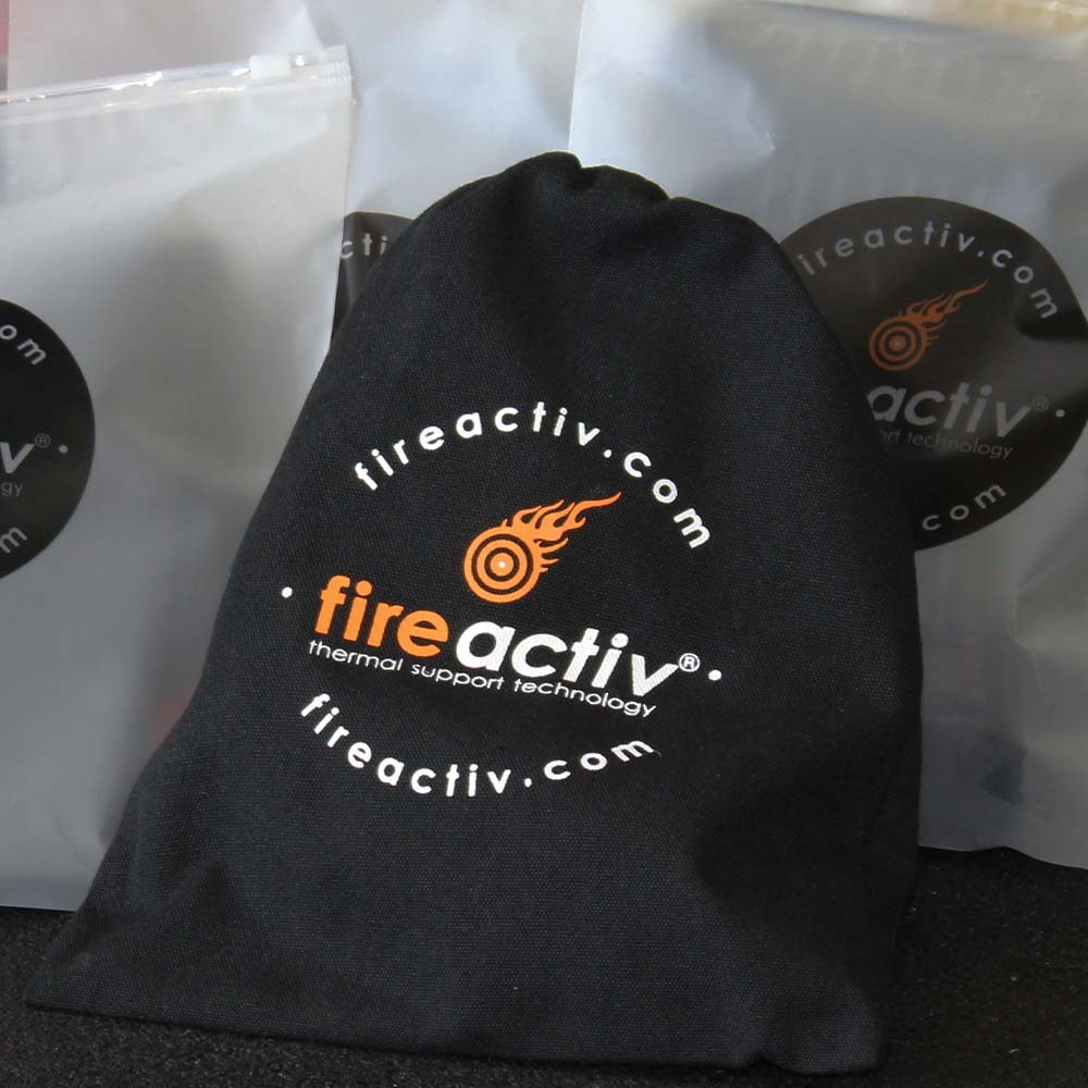 Self-heating back support belt in black worn around the waist for lower back pain relief — view 11