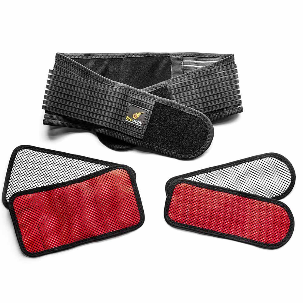 Self-heating back support belt in black worn around the waist for lower back pain relief — view 2