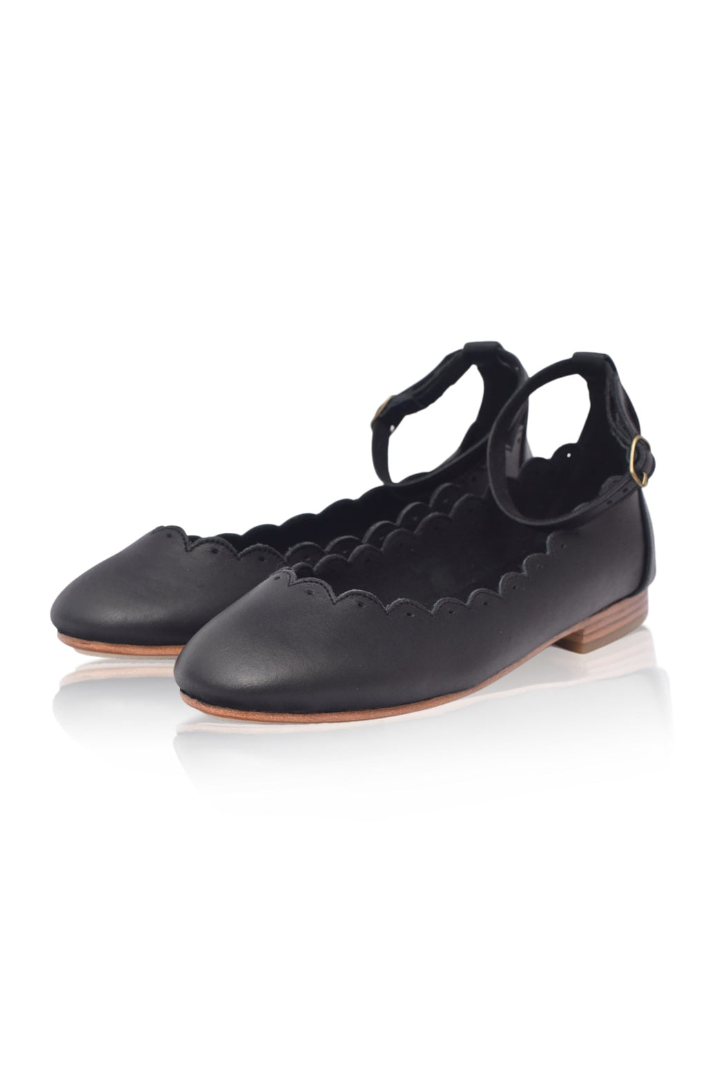 Black genuine leather Fleur scalloped ballet flats with adjustable ankle strap and round toe. — view 3