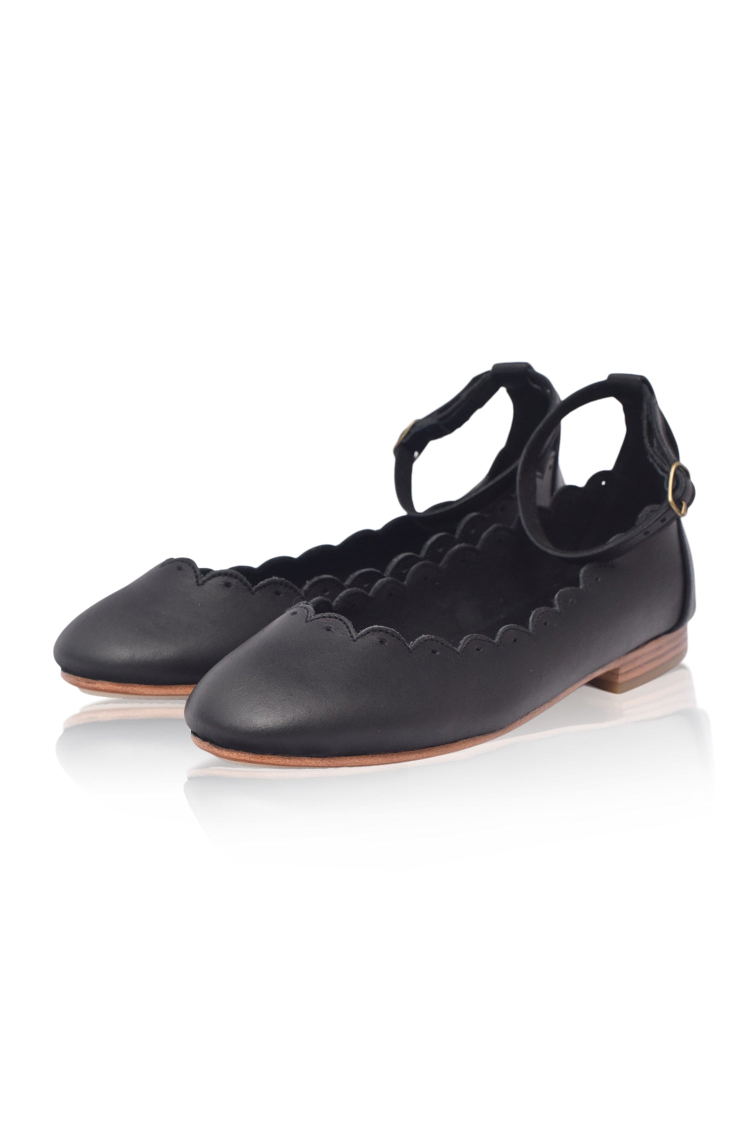 Black genuine leather Fleur scalloped ballet flats with adjustable ankle strap and round toe. — view 3