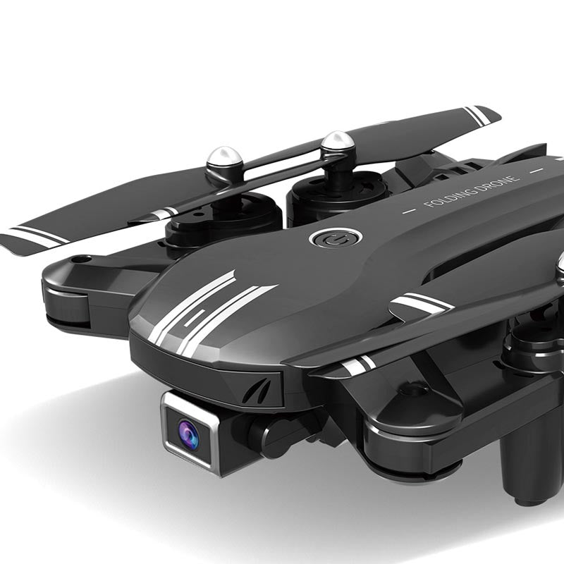 Foldable 4K dual-lens aerial drone in black ABS material with remote control transmitter and accessories — view 4