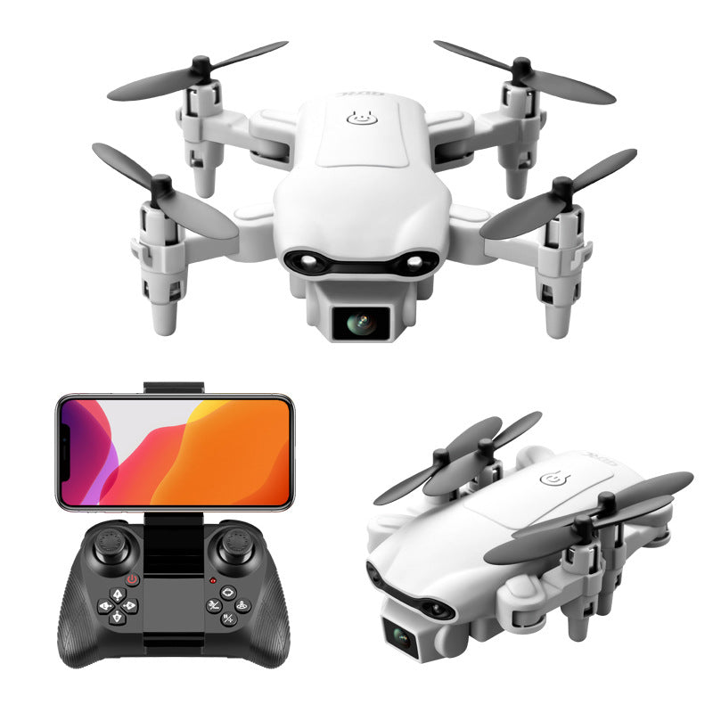 Foldable mini quadcopter drone with HD camera and remote control transmitter in black. — view 2