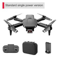 Foldable mini quadcopter drone in black plastic with dual 4K camera and remote controller
