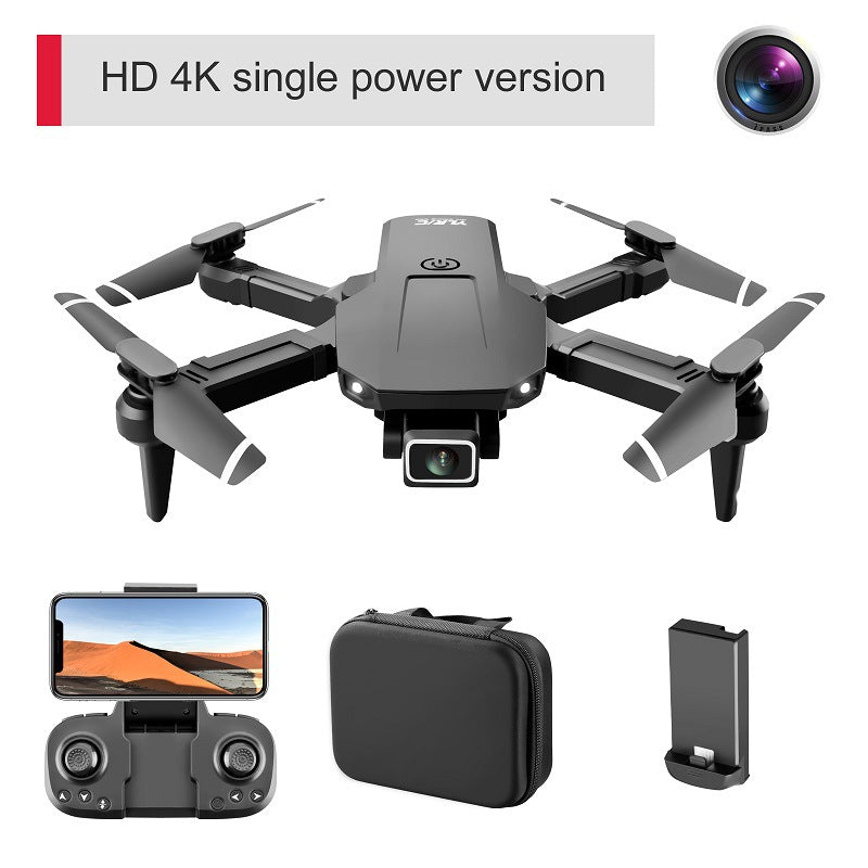 Foldable mini quadcopter drone in black plastic with dual 4K camera and remote controller — view 3