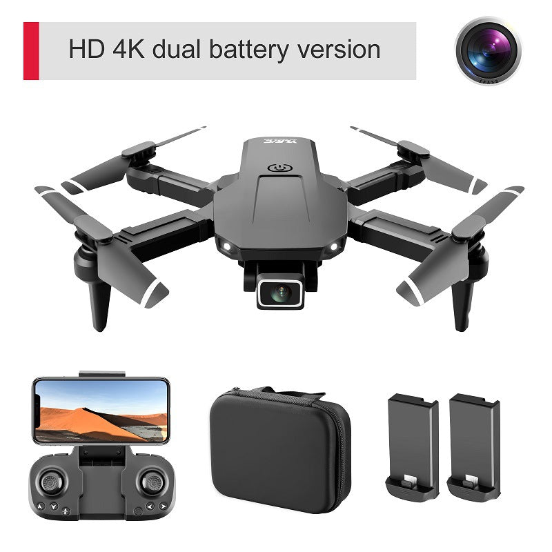 Foldable mini quadcopter drone in black plastic with dual 4K camera and remote controller — view 4