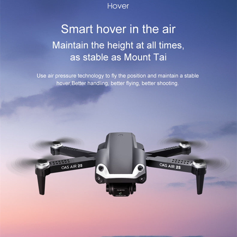 Black folding 4K dual camera drone with remote control and propellers extended for flight