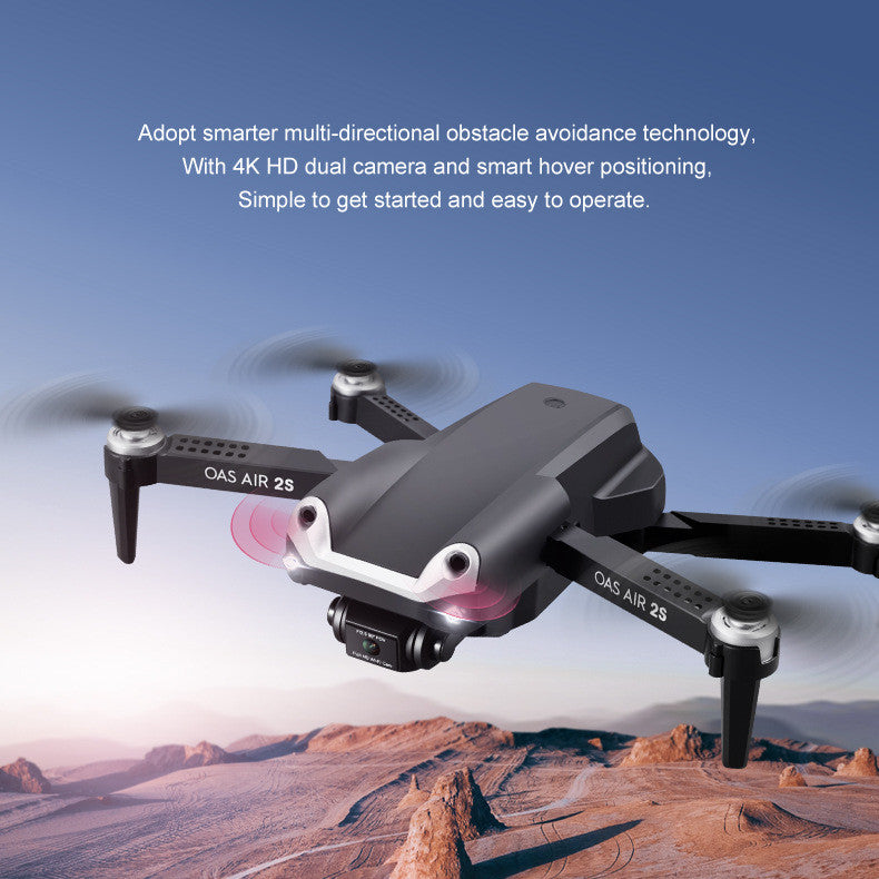 Black folding 4K dual camera drone with remote control and propellers extended for flight — view 2