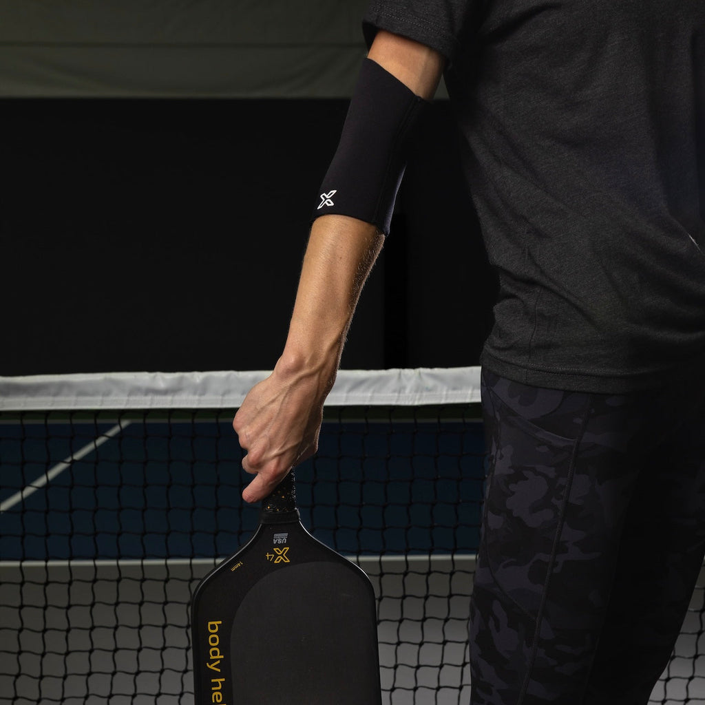 Full elbow compression sleeve made of stretch fabric for joint support and athletic injury recovery — view 5