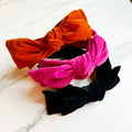 Structured velvet bow headband in a classic elegant style for sophisticated hair styling