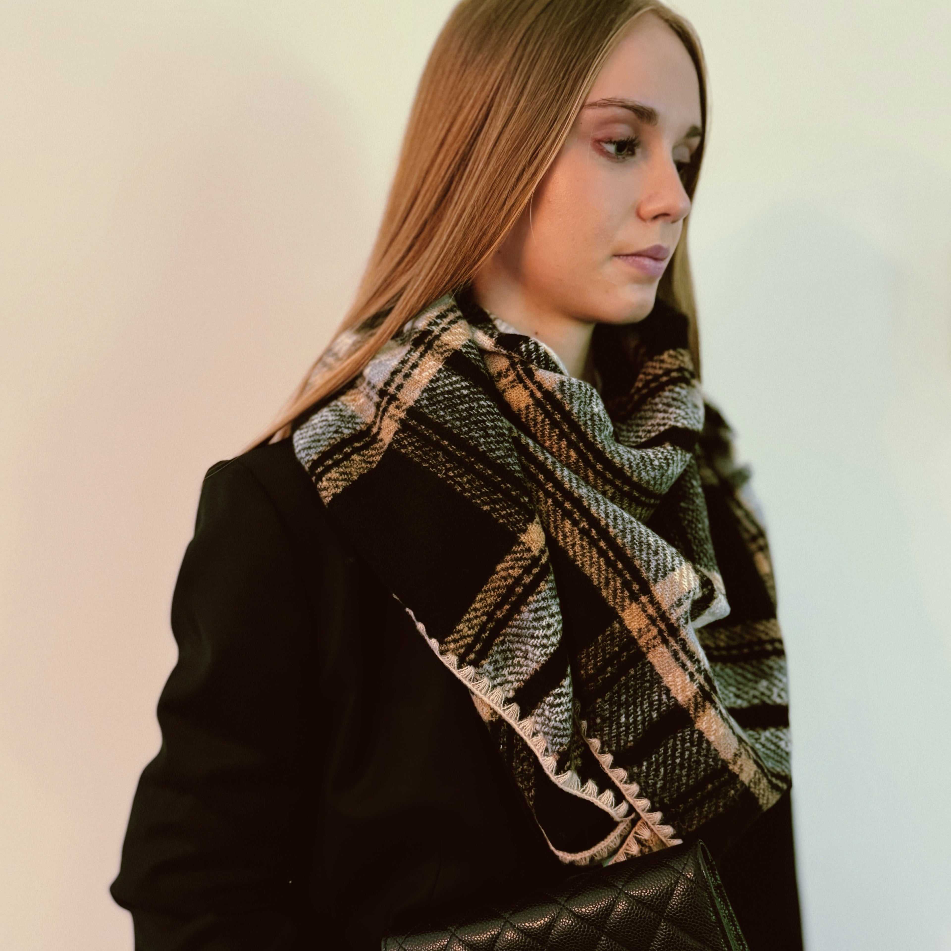 Preciously stitched triangle shawl scarf in plaid pattern with neutral colors and vibrant accents