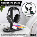 Black minimalist 15W wireless charging headphone stand with smart devices on a modern desk setup