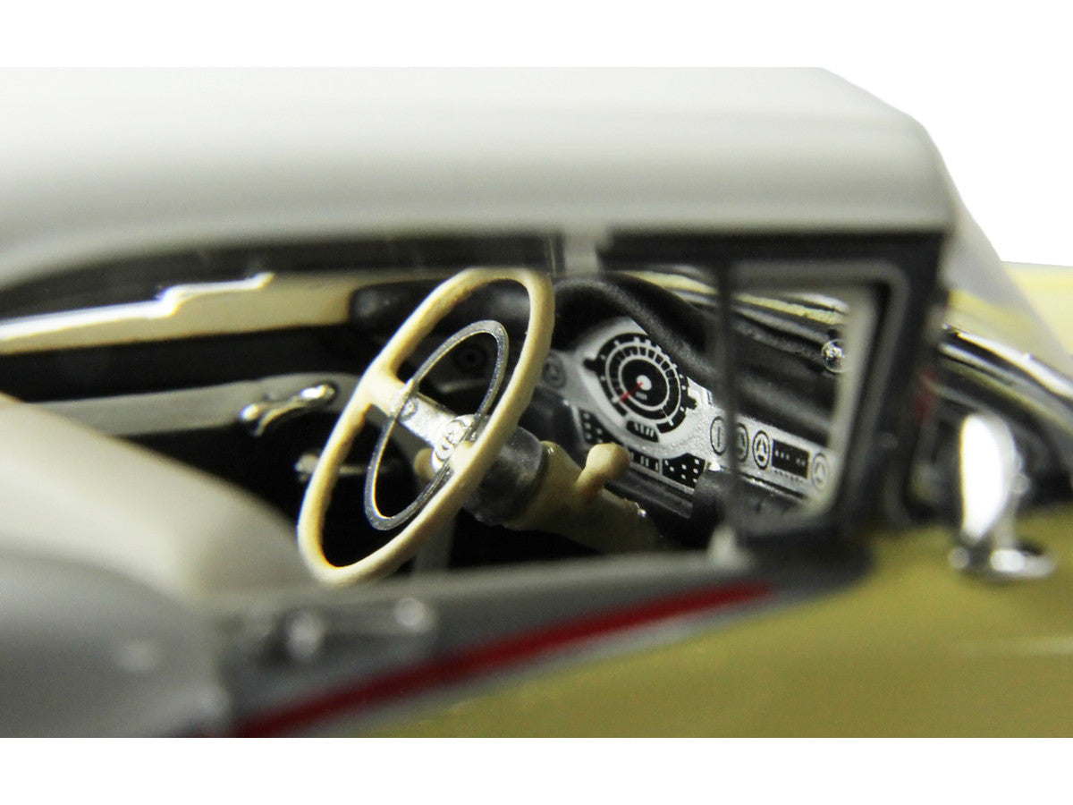 1957 Oldsmobile Starfire 1/43 scale resin model car in yellow and white with clear display — view 3