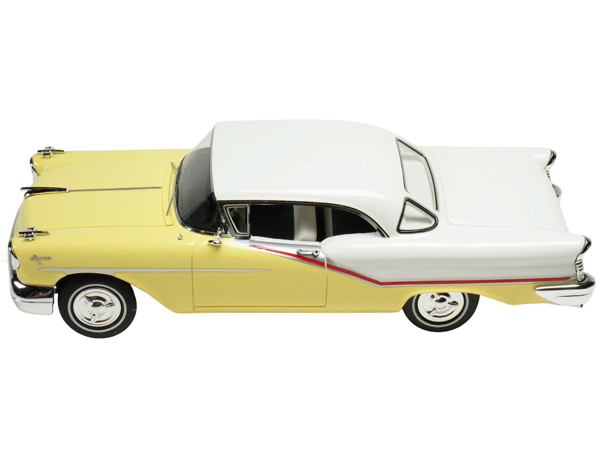 1957 Oldsmobile Starfire 1/43 scale resin model car in yellow and white with clear display