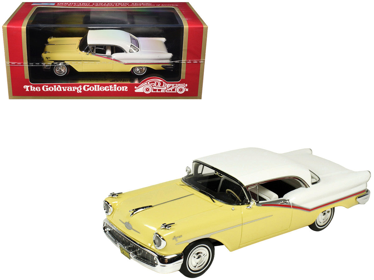 1957 Oldsmobile Starfire 1/43 scale resin model car in yellow and white with clear display — view 5
