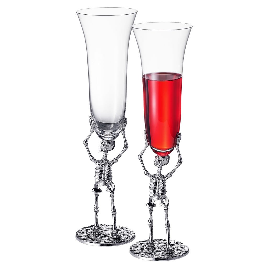 Stemmed skeleton champagne flute set of two in clear glass with intricate bone details