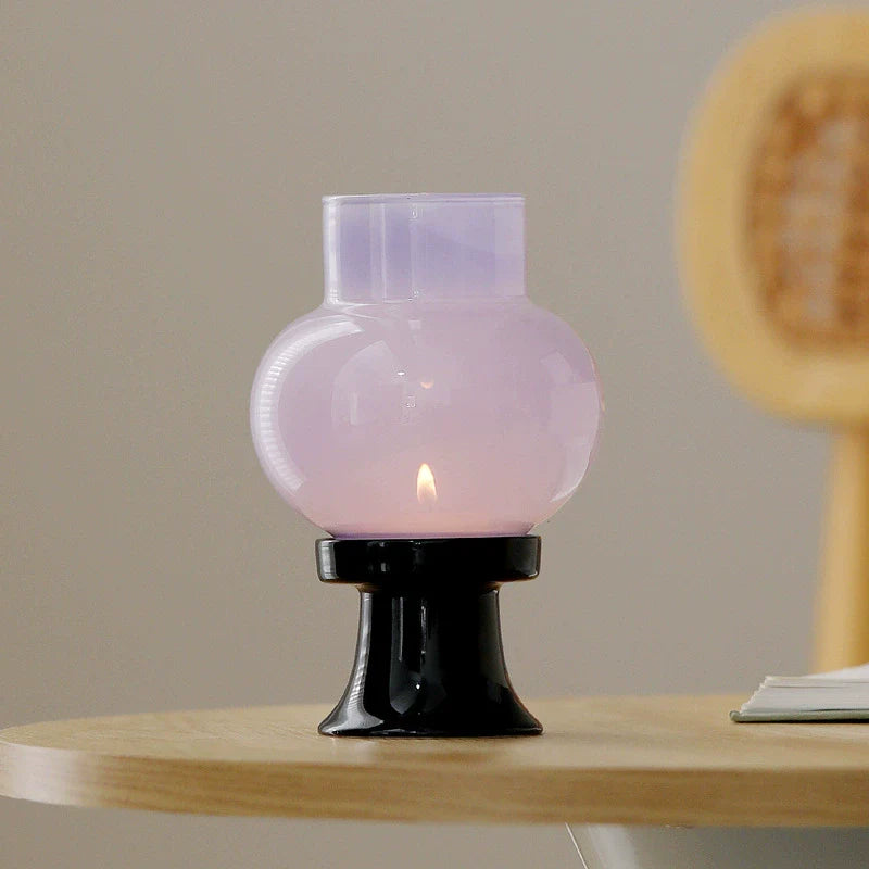Hand-blown heat-resistant glass aroma candle lamp with a sleek black ceramic base
