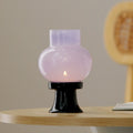 Hand-blown heat-resistant glass aroma candle lamp with a sleek black ceramic base